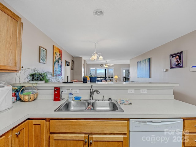 kitchen with white dishwasher and sink