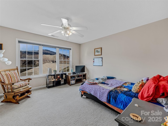 carpeted bedroom featuring ceiling fan