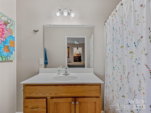 bathroom featuring vanity and a shower with shower curtain