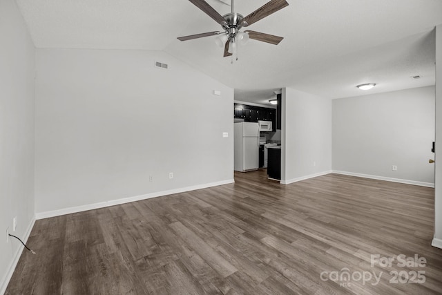 unfurnished living room with dark hardwood / wood-style flooring, lofted ceiling, and ceiling fan