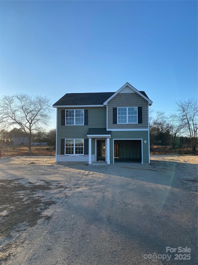 view of front of house with a garage and driveway