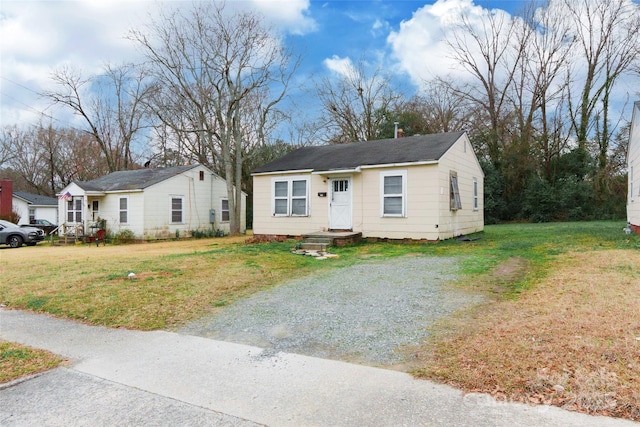 view of front of home with a front yard