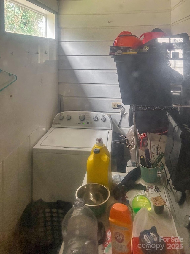 clothes washing area featuring washer / dryer