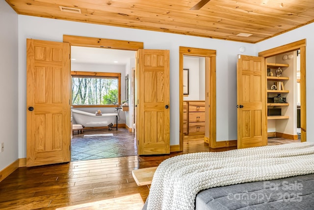 bedroom featuring baseboards, visible vents, wood ceiling, and dark wood-type flooring