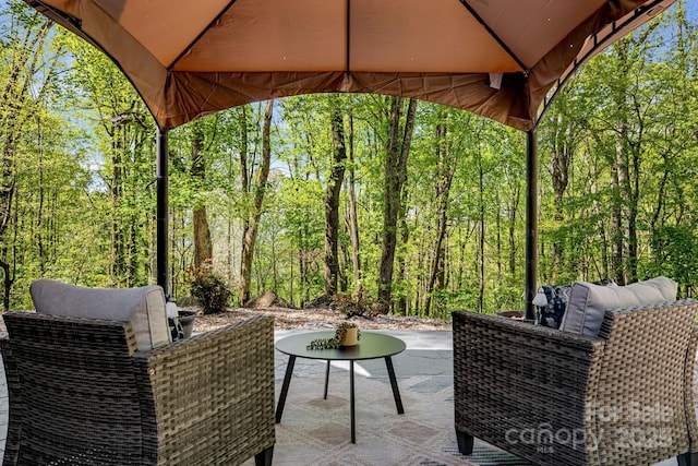 view of patio featuring a view of trees