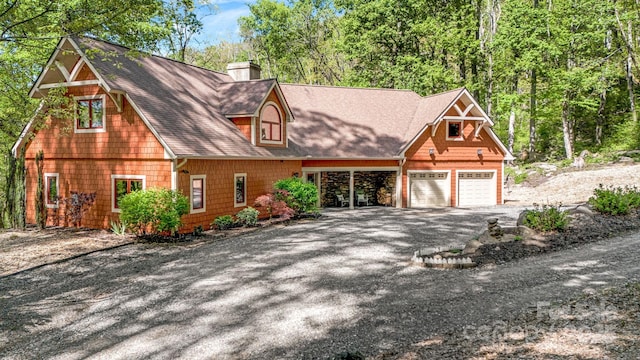 216 Log Gap Rd, Fairview, NC 28730 - view of front facade featuring a chimney, asphalt driveway, and a shingled roof