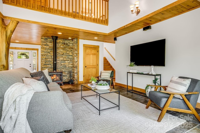 216 Log Gap Rd, Fairview, NC 28730 - living area featuring a wood stove, stairway, baseboards, recessed lighting, and a high ceiling