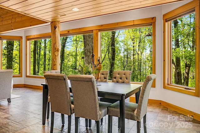 216 Log Gap Rd, Fairview, NC 28730 - dining room featuring baseboards, healthy amount of natural light, stone tile floors, and wooden ceiling
