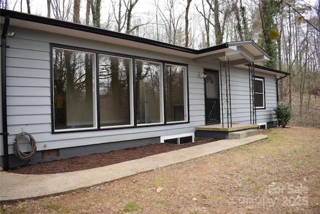 view of home's exterior featuring crawl space