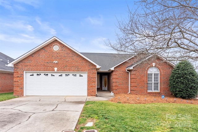 view of front of house with a garage and a front yard