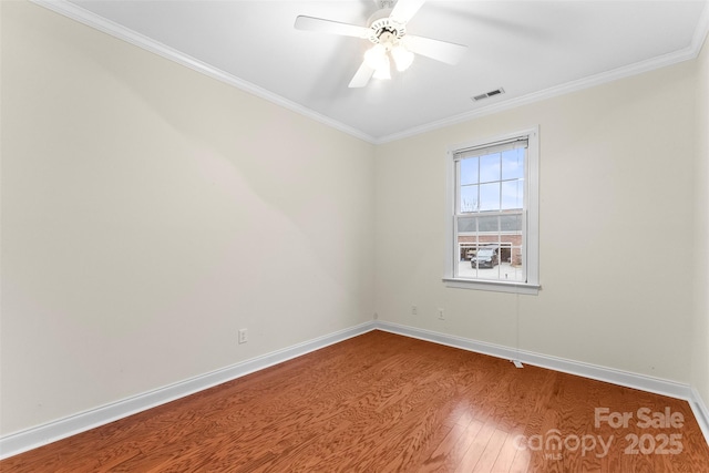 unfurnished room with wood-type flooring, ornamental molding, and ceiling fan