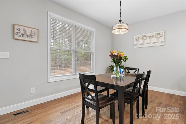 dining space featuring hardwood / wood-style flooring