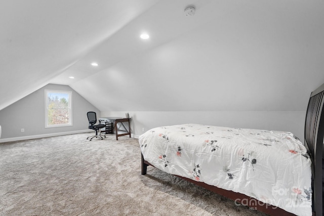 carpeted bedroom featuring lofted ceiling