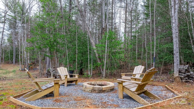 view of patio / terrace featuring an outdoor fire pit