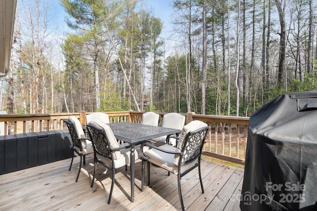 wooden terrace with area for grilling