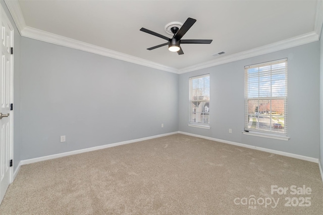unfurnished room featuring ornamental molding, ceiling fan, carpet, and baseboards