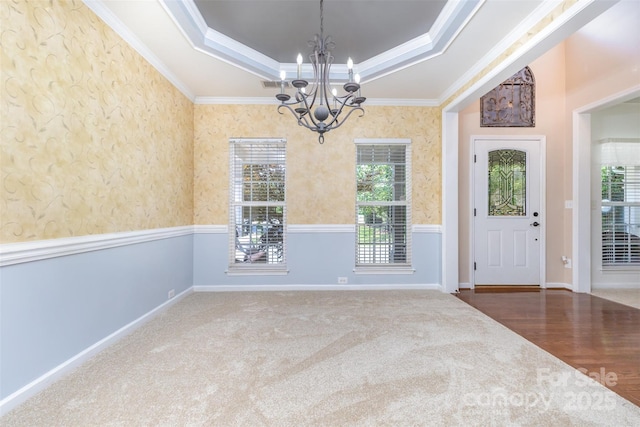 1245 Periwinkle Dr, Waxhaw, NC 28173 - unfurnished dining area featuring a tray ceiling, a chandelier, ornamental molding, and carpet flooring