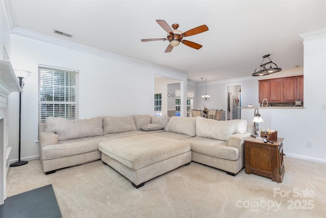 1245 Periwinkle Dr, Waxhaw, NC 28173 - living room with crown molding, a ceiling fan, and light colored carpet