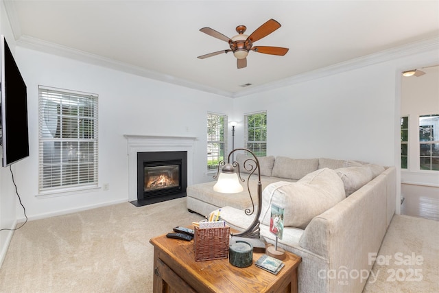 1245 Periwinkle Dr, Waxhaw, NC 28173 - living room featuring crown molding, a ceiling fan, light carpet, and a fireplace with flush hearth