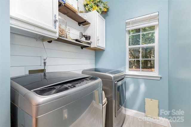 1245 Periwinkle Dr, Waxhaw, NC 28173 - laundry area featuring washing machine and dryer and cabinet space