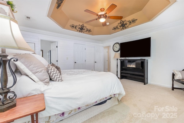 1245 Periwinkle Dr, Waxhaw, NC 28173 - carpeted bedroom with a raised ceiling, crown molding, and a ceiling fan