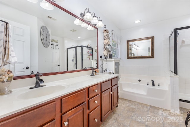 1245 Periwinkle Dr, Waxhaw, NC 28173 - bathroom featuring a stall shower, a bath, double vanity, and recessed lighting
