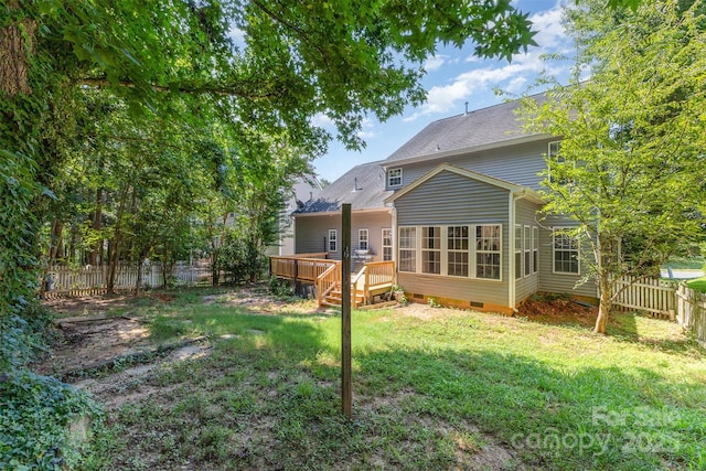 1245 Periwinkle Dr, Waxhaw, NC 28173 - rear view of property with crawl space, a fenced backyard, a wooden deck, and a sunroom