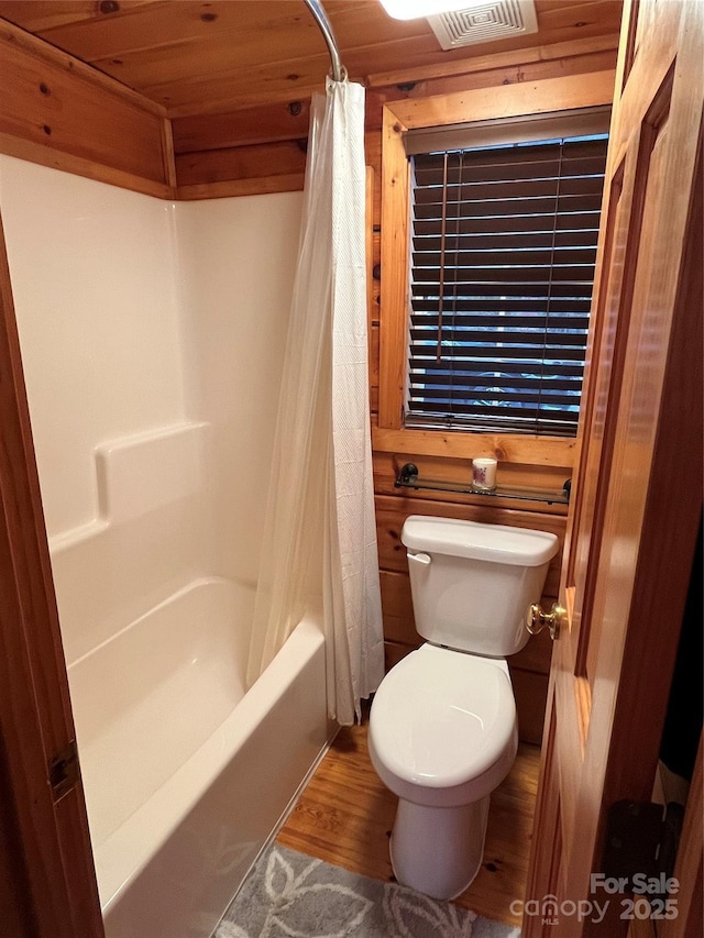 bathroom featuring shower / bath combination with curtain, wood ceiling, toilet, and hardwood / wood-style floors