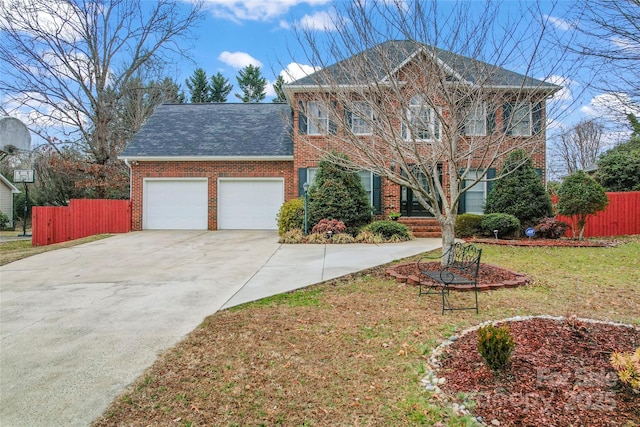 view of front of house featuring a garage and a front yard