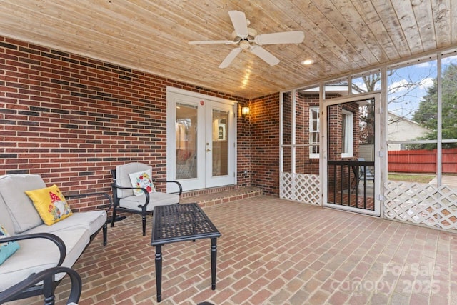 sunroom / solarium with french doors, ceiling fan, and wooden ceiling