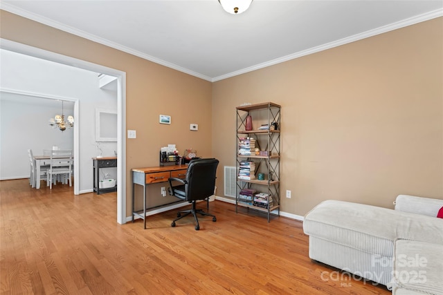 office area featuring ornamental molding, an inviting chandelier, and light hardwood / wood-style flooring