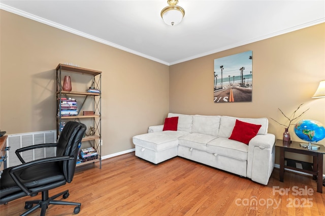 office with crown molding and hardwood / wood-style flooring