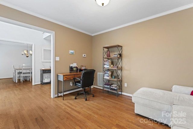 office area featuring hardwood / wood-style flooring, ornamental molding, and an inviting chandelier