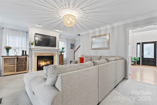 carpeted living room featuring ornamental molding