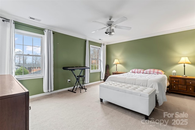 bedroom featuring crown molding, light carpet, and ceiling fan