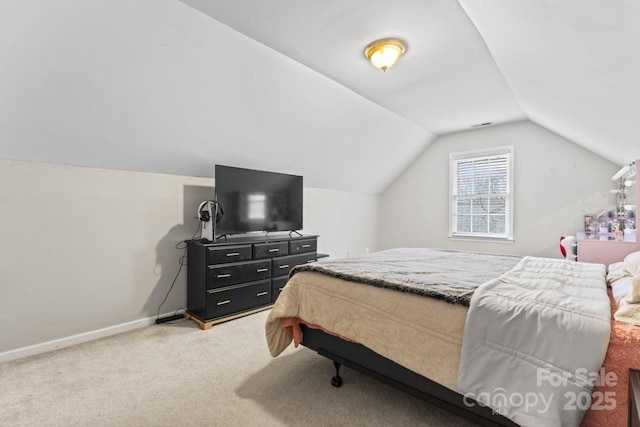 carpeted bedroom with vaulted ceiling