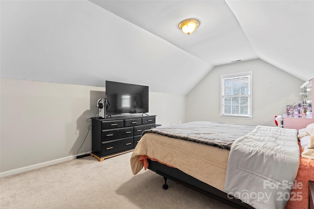 carpeted bedroom featuring lofted ceiling