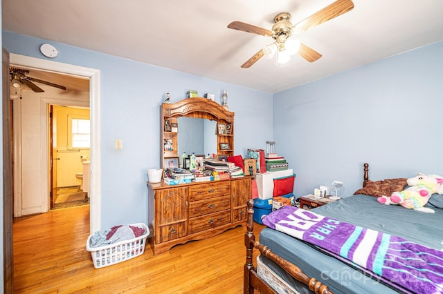 bedroom with wood-type flooring and ceiling fan