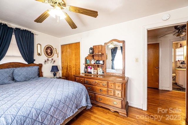 bedroom featuring ceiling fan and wood-type flooring