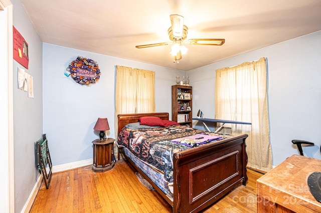 bedroom featuring wood-type flooring and ceiling fan