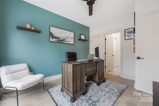 office space with ceiling fan and light hardwood / wood-style flooring