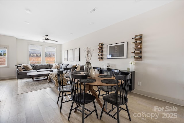 dining space featuring ceiling fan and light hardwood / wood-style floors