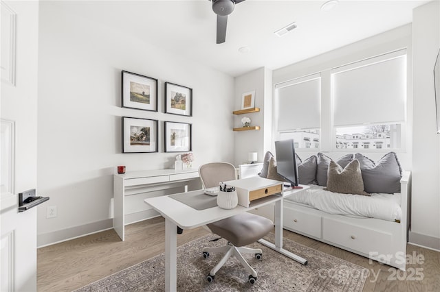 home office featuring ceiling fan and light wood-type flooring