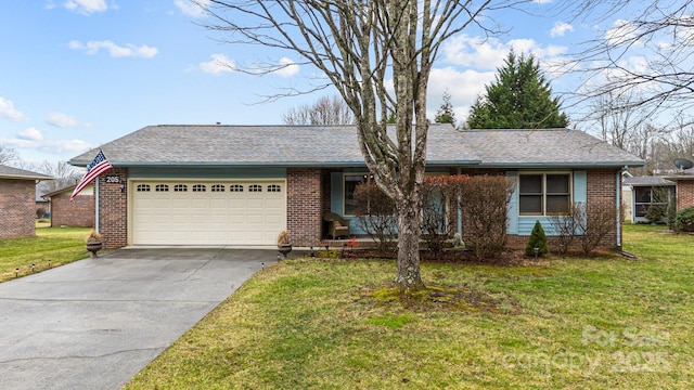 ranch-style home with a garage and a front yard