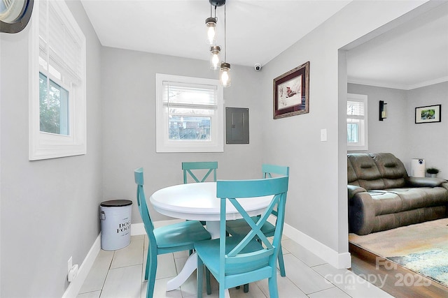 tiled dining room featuring electric panel