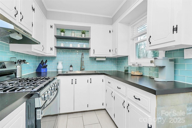 kitchen with sink, gas stove, white cabinetry, crown molding, and light tile patterned floors