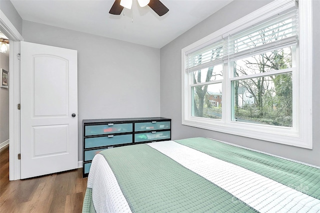 bedroom featuring dark wood-type flooring and ceiling fan