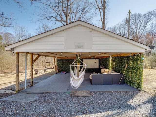 view of parking / parking lot with a carport and driveway