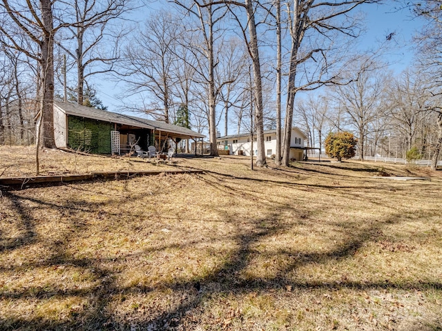 view of yard with a pole building and an outbuilding