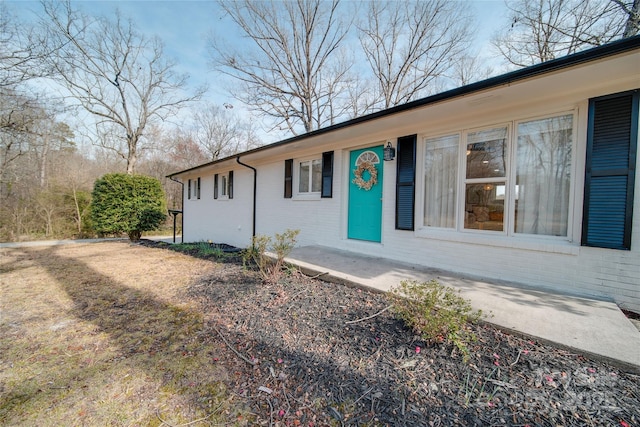 view of front of home with brick siding